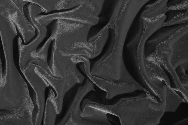 istock Texture of gray bright velvet folded in gentle waves. 1389800775