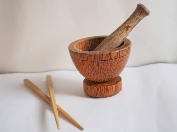 istock Carrying a mortar with flail and chopsticks on a white background 1389803827