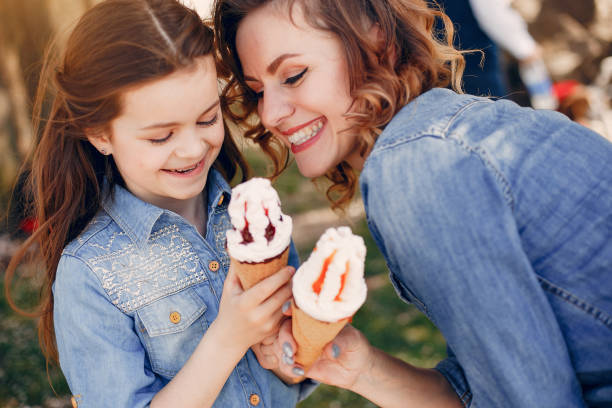 istock Cute and stylish family in a spring park 1389804517