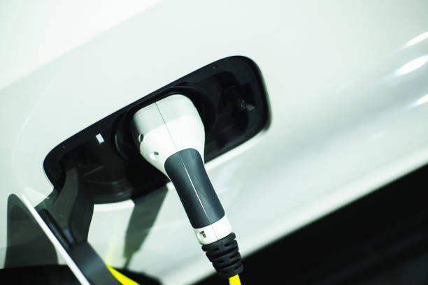 istock The process of charging an electric vehicle. Electric car socket., copy space for text. 1389806618