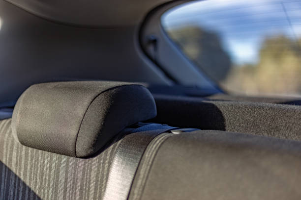 istock Car interior at sunset. Headrest and rear windshield. Concept: Drive through natural environments 1389813549