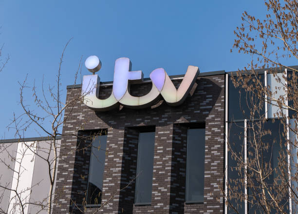 ITV sign on building in Media City Salford 23rd March 2022: ITV sign on one of the ITV Granada buildings in Media City, Salford in Manchester. The northern arm of the ITV studios has been based in Media City since 2013. Located by the Manchester Ship Canal the land has been developed for media companies, including the BBC, to have more north of England investment and involvement. itv photos stock pictures, royalty-free photos & images