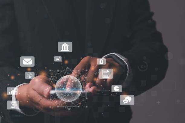 istock Businessman using mobile smart phone, IoT Internet of Things, Digital marketing media (website ad, email, social network, SEO, video, mobile app) E-commerce and online shopping concept 1389818099