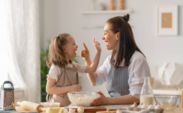 istock family are preparing bakery together 1389819739