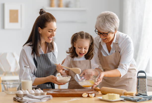 istock family are preparing bakery together 1389820090