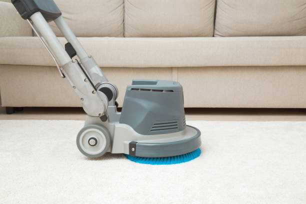 Professional disc machine on light beige carpet at home room. Closeup. Foaming and brushing equipment. Commercial cleaning service. Side view. stock photo