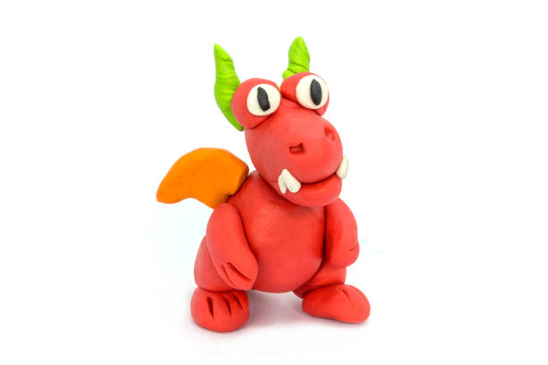 istock Play plasticine Dragon on white background. Handmade clay plasticine 1389820876