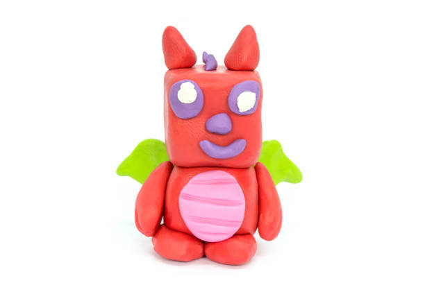 istock Play plasticine Dragon on white background. Handmade clay plasticine 1389820885
