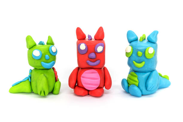istock Play plasticine Dragon on white background. Handmade clay plasticine 1389820887