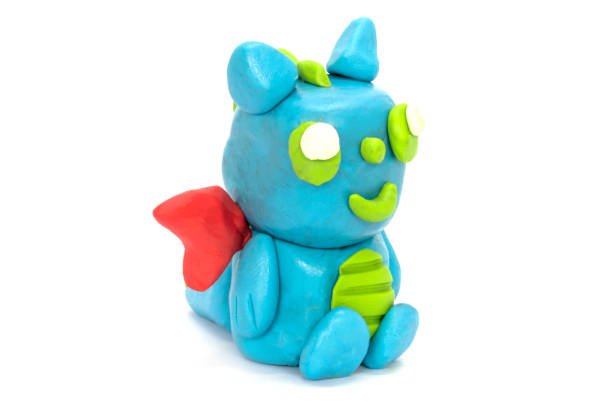 istock Play plasticine Dragon on white background. Handmade clay plasticine 1389820891