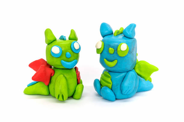 istock Play plasticine Dragon on white background. Handmade clay plasticine 1389820892