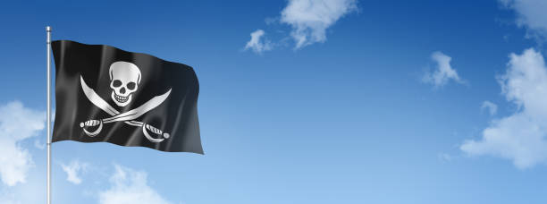 istock Pirate flag, Jolly Roger isolated on a blue sky. Horizontal banner 1389821906