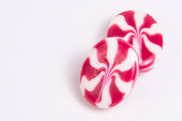 istock Candy spiral milky sweet isolated on the white background 1389823976