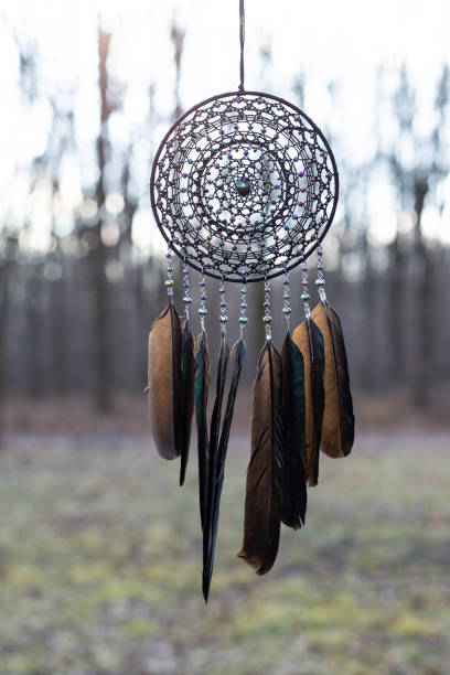 istock Handmade dream catcher with feathers threads and beads rope hanging 1389823984