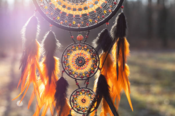 istock Handmade dream catcher with feathers threads and beads rope hanging 1389823985