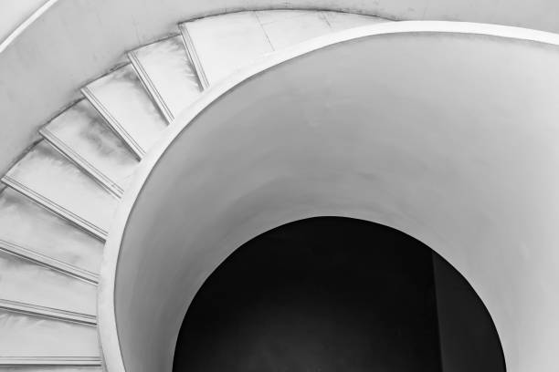 istock Spiral staircase, monochrome image 1389824411