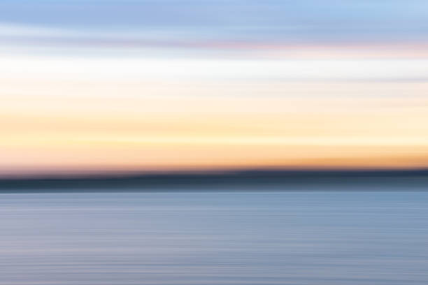 istock Coastal background image of sunset colors 1389827761