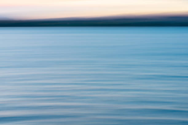 istock Coastal background image of sunset colors 1389827799