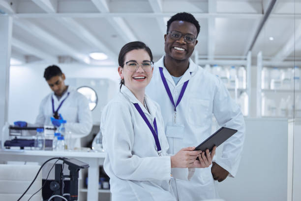 istock Shot of two colleagues working together on a scientific project using a digital tablet 1389831793
