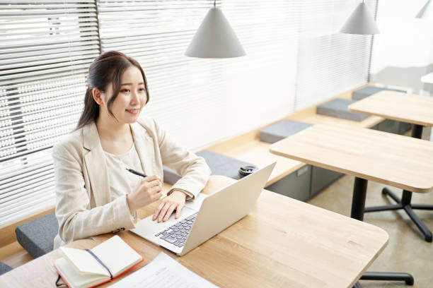 istock Asian woman working in a coworking space 1389835180