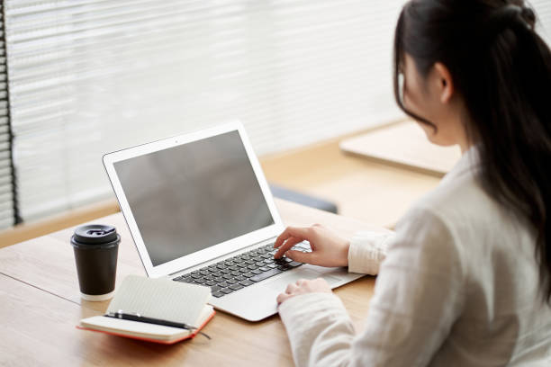 istock Asian woman working in a coworking space 1389835195