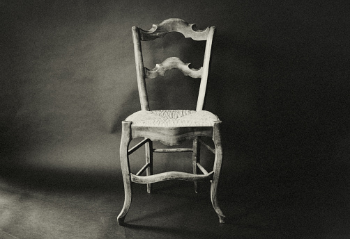 An old southern French chair in the studio. Loneliness, memories, timeless.