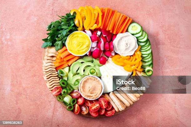 Colorful Vegan Charcuterie Board With Raw Vegetables And Whole Wheat Snacks Stock Photo - Download Image Now