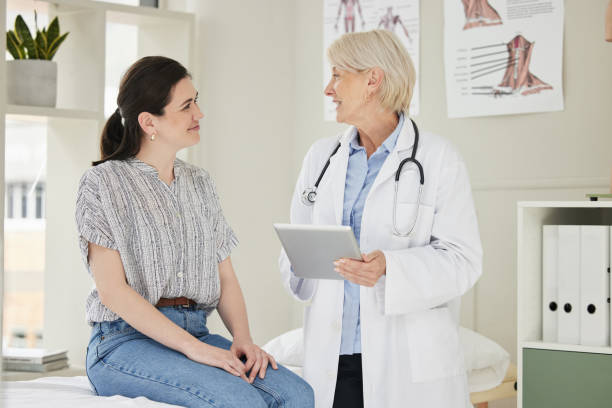istock Shot of a mature doctor using a digital tablet during a consultation 1389841466