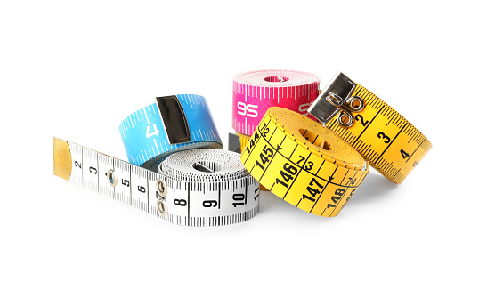 Kit of different measuring tapes isolated on white