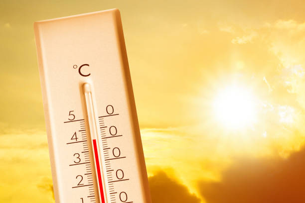 istock Weather thermometer showing high temperature and sunny sky with clouds on background 1389843542