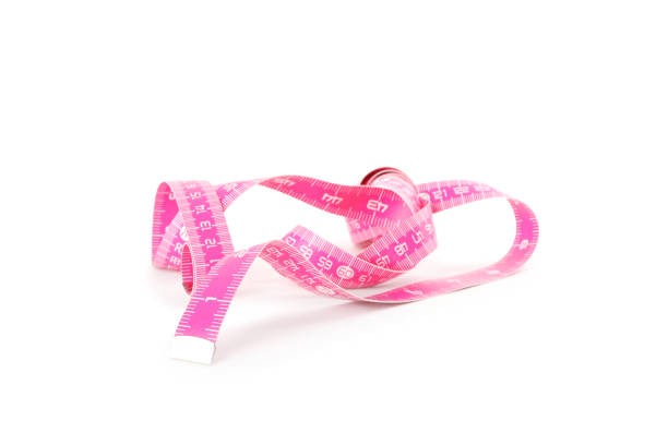 istock New pink measuring tape isolated on white 1389843697