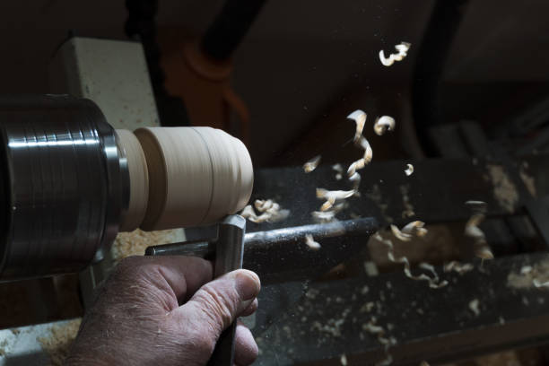 istock carving iron wood turning fast spinning workpiece 1389843986