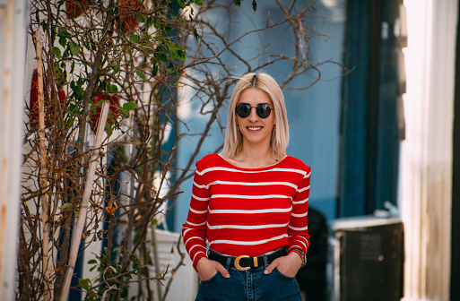 Portrait of Blonde Woman in Red Blouse