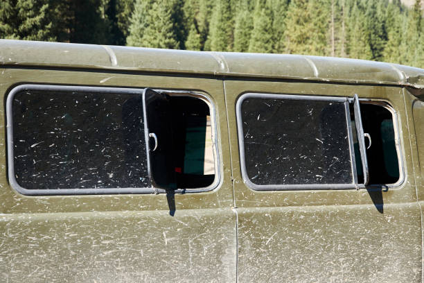 istock side of the car and the windows splattered with mud 1389844349