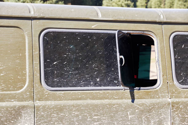 istock side of the car and the windows splattered with mud 1389844358