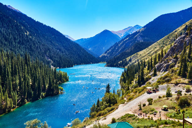 istock view of a mountain lake surrounded by forest 1389844945