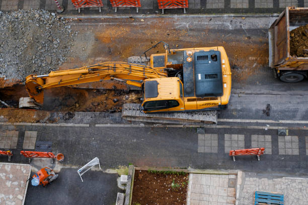 istock construction equipment excavates a city street 1389844974