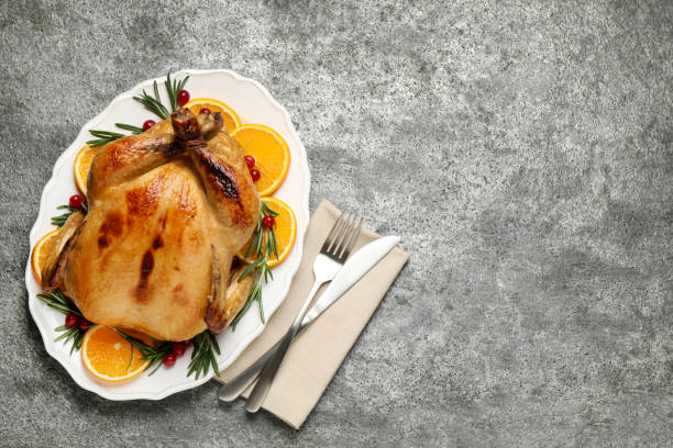 istock Delicious cooked turkey served on grey table, flat lay with space for text. Thanksgiving Day celebration 1389845539