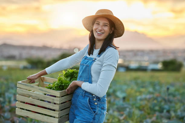 istock Shot of a young farmer standing on a open field 1389848490