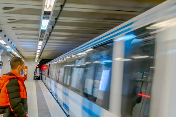 Algiers, Algeria - March 3, 2022:  The train is arriving with a motion blur effect, unrecognizable people waiting