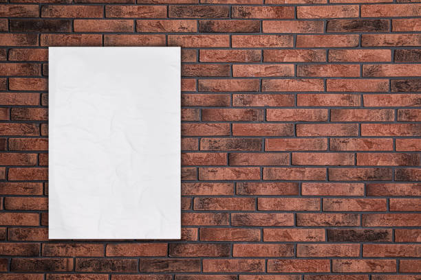 istock Blank creased poster on brick wall. Mockup for design 1389849133