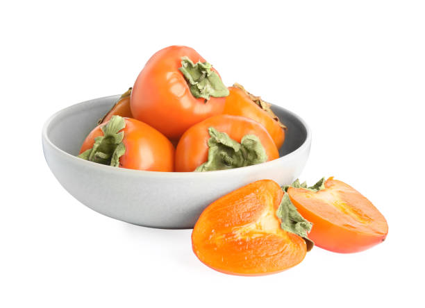istock Bowl with delicious fresh persimmons isolated on white 1389849816