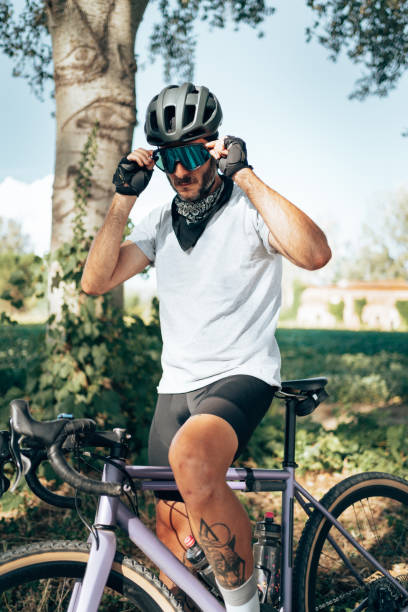 istock cyclist standing in the countryside 1389850261