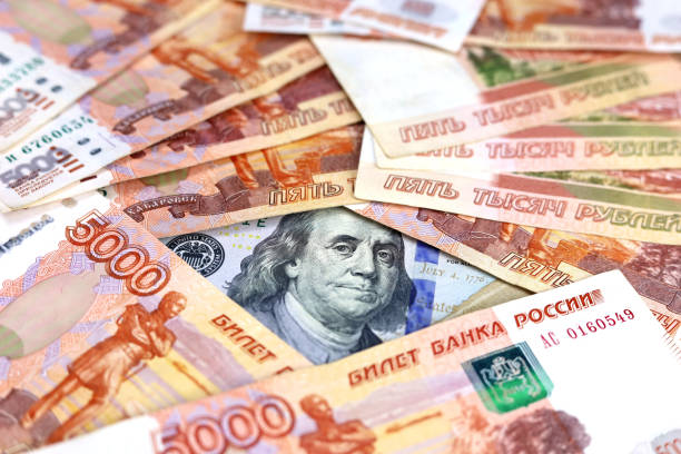 istock US dollar surrounded by russian rubles 1389850377
