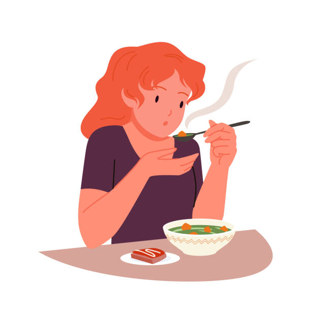głodna dziewczyna jedząca gorącą zupę łyżką, osoba siedząca przy stole z miską i kanapką - chef food cooking sandwich stock illustrations