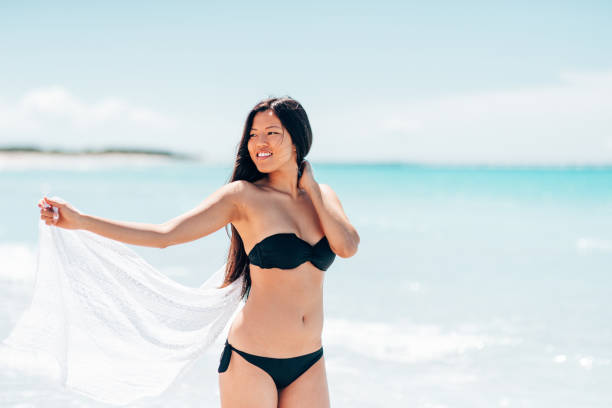 istock chinese sensual woman on the beach 1389851510