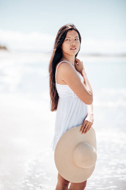istock chinese sensual woman on the beach 1389851562