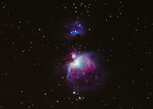 Faithful representation of Orion nebula M42, together with NGC 1977, Running Man Nebula. Made with a DSLR and Samyang 135mm f2.0 lens. Careful processing, no destructive noise reduction has been used.