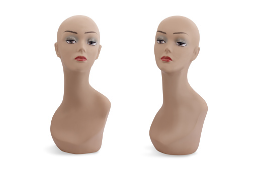 Set of silicone mannequins of a beautiful bald woman with make-up isolated on a white background