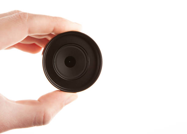 istock image of photo lens hand white background 1389851734
